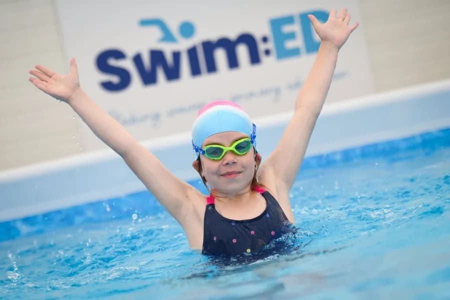 Children taking part in school swimming with Swim Learn Achieve