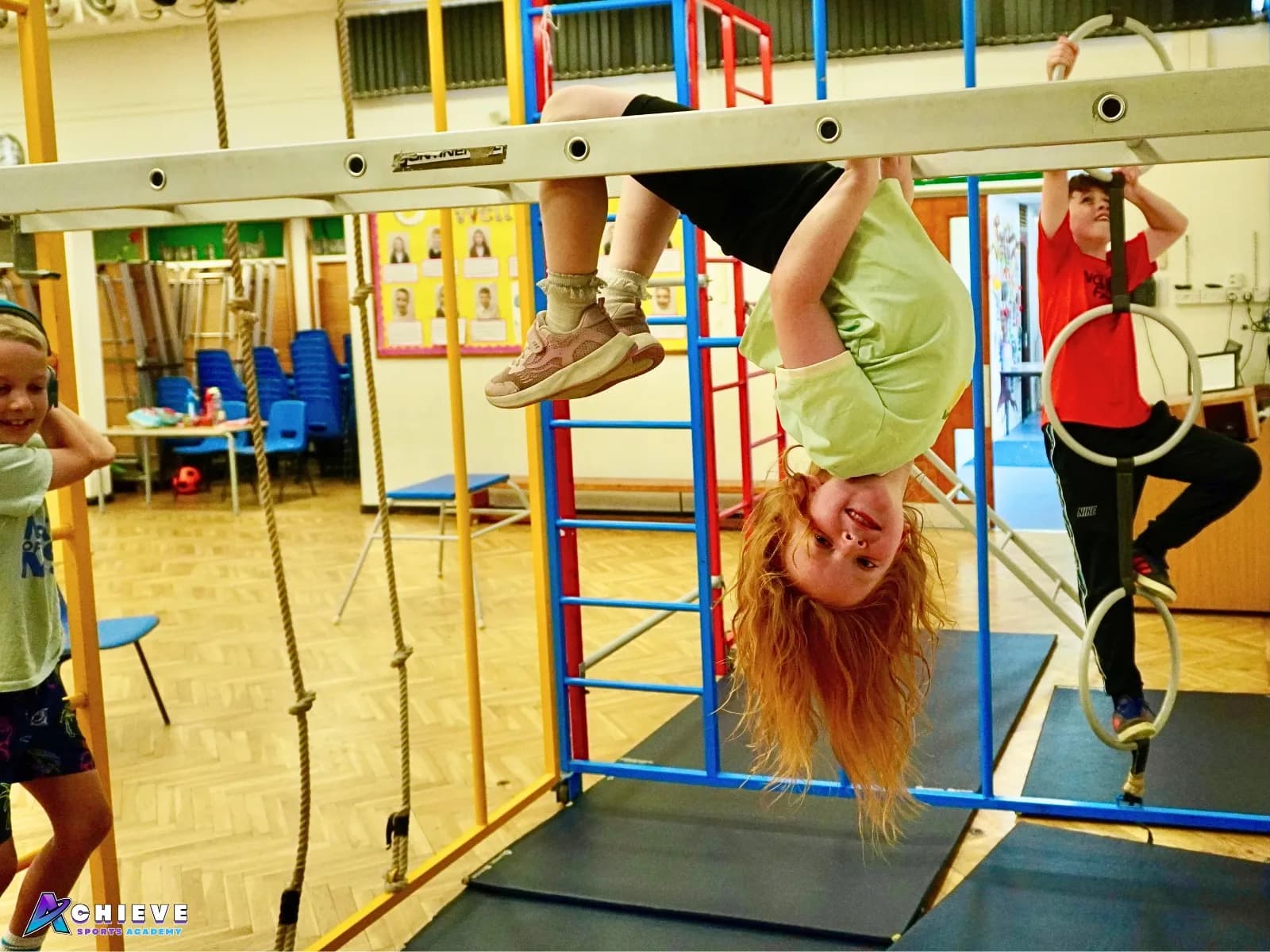 Children enjoying climbing and active play during an Achieve Holiday Camp