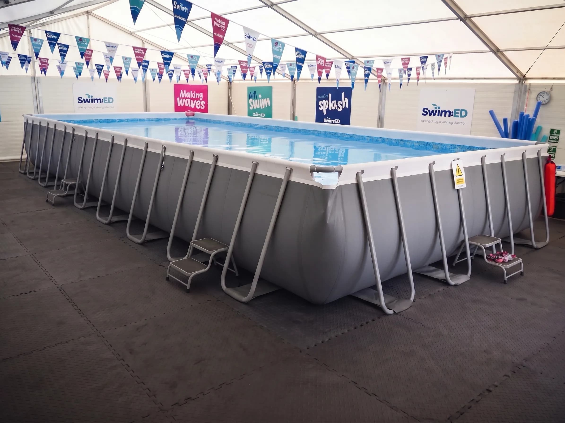 Swim:ED pool with prepared interlocking flooring around the swimming area