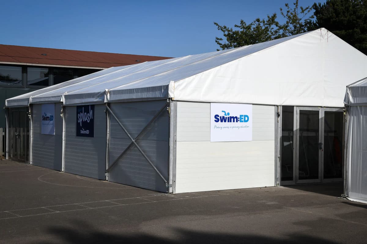 Swim Learn Achieve temporary indoor pool structure on a school site